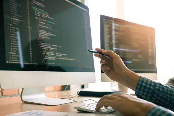 Developing programming working in a software engineers code tech applications on desk in office room. Developing programming working in a software engineers code tech applications on desk in office room. internet provider stock pictures, royalty-free photos & images