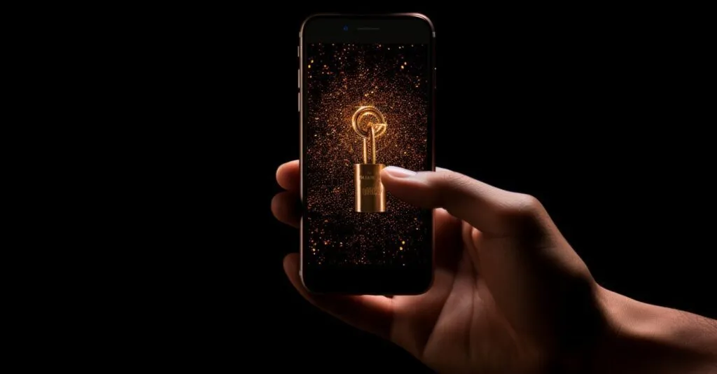 Hand Holding A Key Unlocking A Digital Padlock