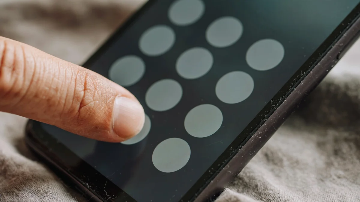 Close-up of a smartphone keypad with a prefix code being dialed